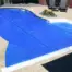 Slight overhead angle of freeform ClearDeck cover for a swimming pool in New York