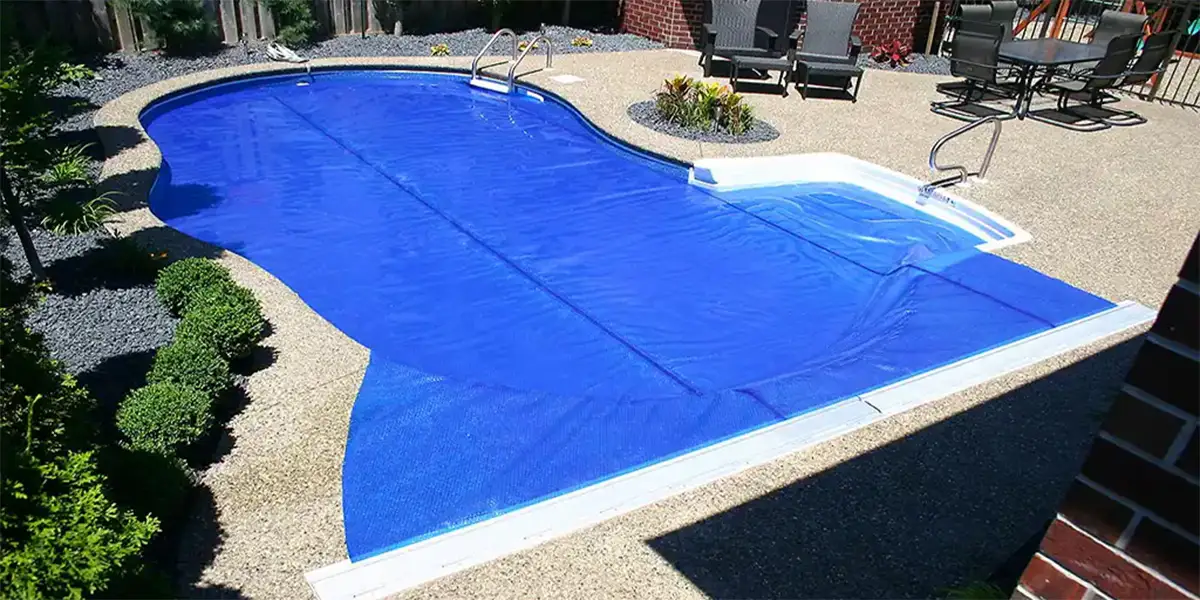 Slight overhead angle of freeform ClearDeck cover for a swimming pool in New York
